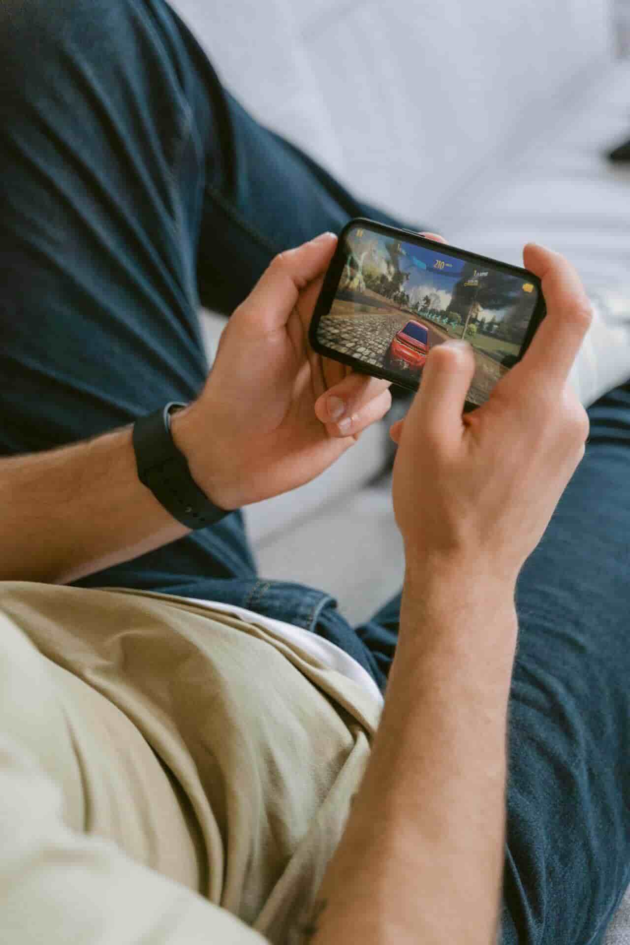 a boy playing mobile game in mobile