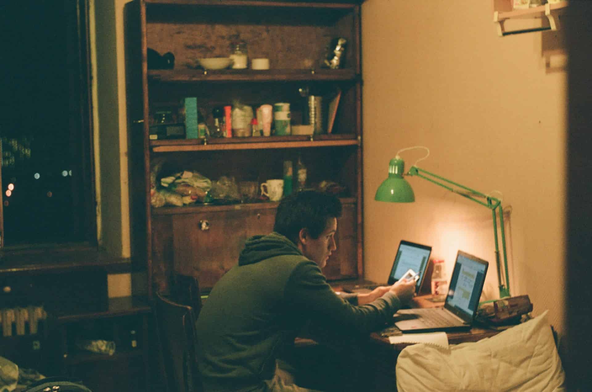 Young man working on laptop at home for online earning